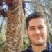 Komeil next to a Mazafati date palm